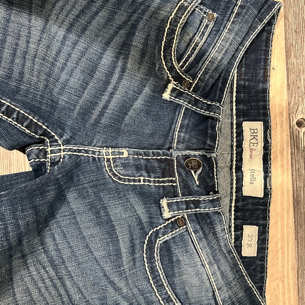 Womens buckle blue jeans